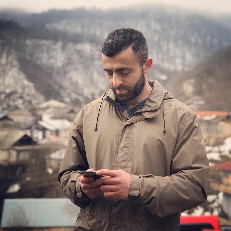 Narek Hambardzumyan outdoors with mountains in background